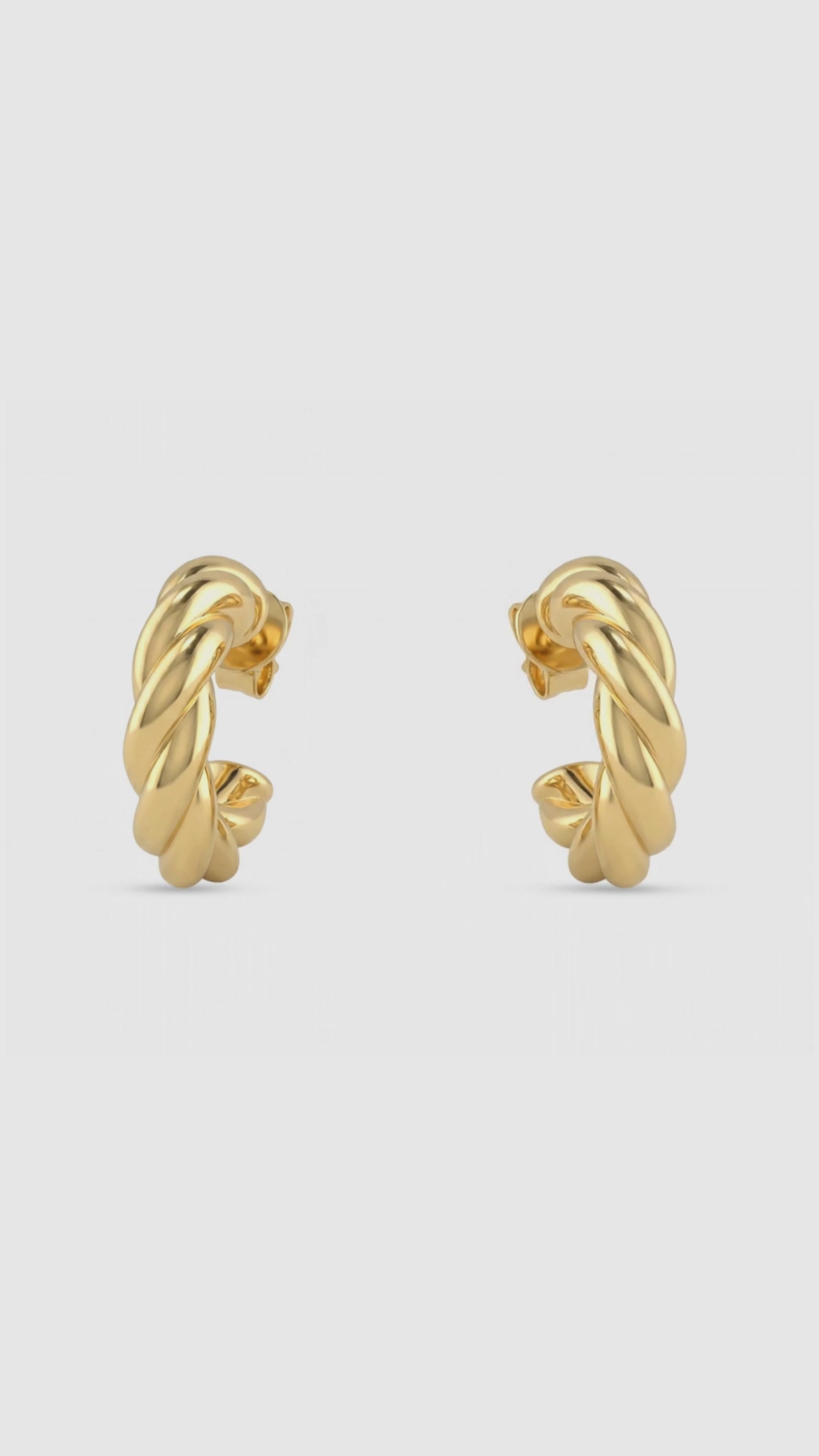 Load video: Torque Hoop Earrings